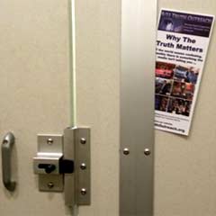 brochure in bathroom door