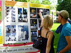 A couple examines Joseph's posters.
